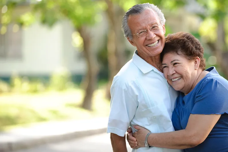 Happy senior couple reviewing Medicare plan options together